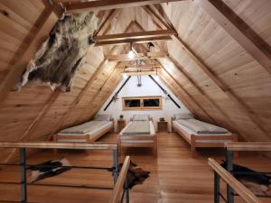 a bedroom in a tree house with two beds at Antić apartmani Stara planina in Crni Vrh