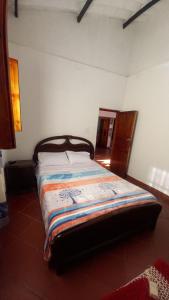 Postel nebo postele na pokoji v ubytování Hostal posada San jose