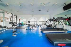 a gym with several treadmills and cardio machines at Lime Tree Bay Unit # 40 in West Bay