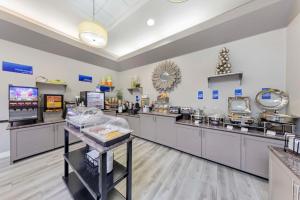 a restaurant with a food counter in a store at Best Western Canoga Park Motor Inn in Canoga Park
