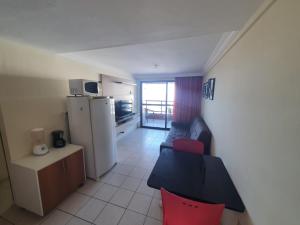 a small apartment with a kitchen and a living room at Apartamento 403 - Largo de Tambau in João Pessoa