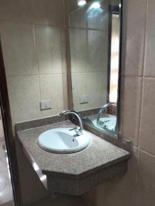 a bathroom counter with a sink and a mirror at light house camp in Dahab