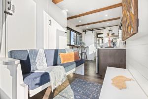 a living room with a couch and a table at Tiny Cargo Home North in Tulare