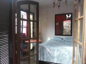 Ένα ή περισσότερα κρεβάτια σε δωμάτιο στο Pousada Center Lux