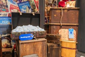 a pile of old chests and trunks in a store at Wonka Sweet Suite - New York in New York
