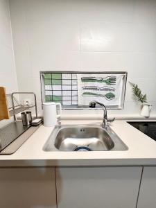 a kitchen sink with a faucet on top of it at [New!] 3BR & 2Bath for big group in Seoul