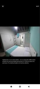 a picture of a small room with a bed at Quédate con Marcel in Cali