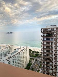a view of the ocean from a building at Real Apartments 254 - Barramares flat 2 quartos de luxo com vista espetacular in Rio de Janeiro