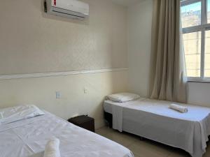 Tempat tidur dalam kamar di Maravilha de Copacabana