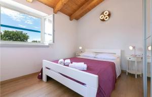 Postel nebo postele na pokoji v ubytování Villa Irena Funtana