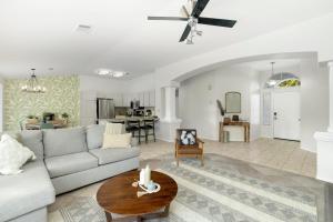 a living room with a couch and a table at Revitalizing 3 Bedroom Home With Pool, Pet-Friendly, Wi-fi in Bakersfield