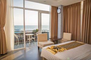 Postel nebo postele na pokoji v ubytování Seaside Resort Vung Tau + 37 fotografií