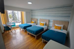 Postel nebo postele na pokoji v ubytování Golden Mar Hotel