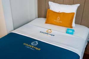 Postel nebo postele na pokoji v ubytování Golden Mar Hotel
