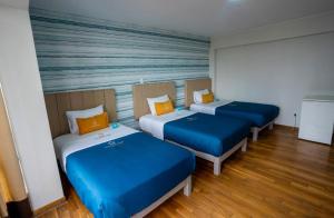 Postel nebo postele na pokoji v ubytování Golden Mar Hotel