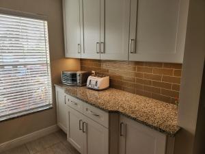 Photo de la galerie de l'établissement Sun&Fun - Beautiful renovated 2/2 villa in Jupiter, à Jupiter 17 autres photos