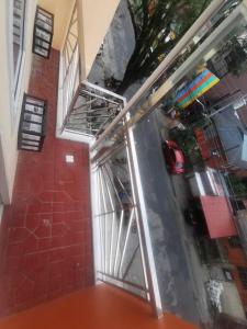an open door in a room with a red wall at Naga City Stylish Condo in Naga