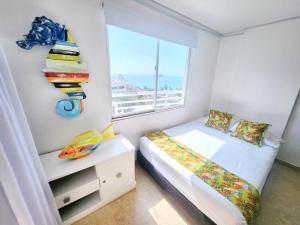 Cama o camas de una habitación en Flat In Rodadero Beachfront With 2 Bedrooms