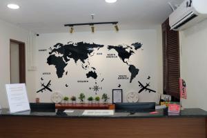 a wall with a map of the world on it at Hotel Seri Putra in Kuala Lumpur
