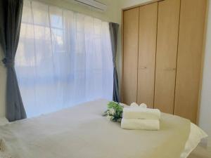 Una cama o camas en una habitación de 100m from nearest bus stop/8 mins to Ikebukuro sta
