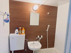 a bathroom with a toilet and a sink at 100m from nearest bus stop/8 mins to Ikebukuro sta in Tokyo