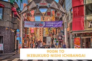 a busy city street with signs and buildings at 100m from nearest bus stop/8 mins to Ikebukuro sta in Tokyo