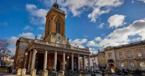 a building with a tower with a clock on it at Market Haven Kingsize Studios Town Centre with Netflix, Business & Leisure travellers, multiple units available in Northampton