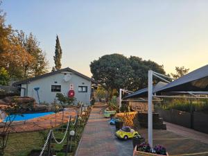 a backyard with a toy car and a playground at The Haven: Make our Home your Home in Estcourt
