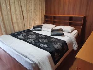 Postel nebo postele na pokoji v ubytování Happy inn
