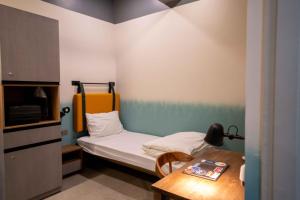 Llit o llits en una habitació de Draper Startup House for Entrepreneurs Hyderabad