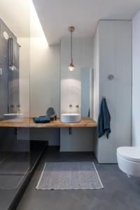 a bathroom with a sink and a toilet at @HOME - Mini In Centro Storico in Padova