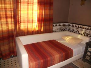 Postel nebo postele na pokoji v ubytování Riad Passiflora