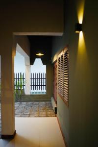 a hallway of a house with a window at Chariot Square in Kandy