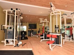 a gym with several treadmills and machines at 3 Bed in Ledbury 77379 