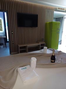 a hotel room with two towels on a bed at Barocco Island Studios in Skala Potamias