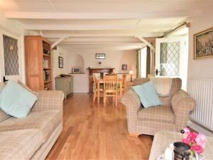 a living room with two couches and a table at 3 bed in Perranporth 57204 in Perranzabuloe