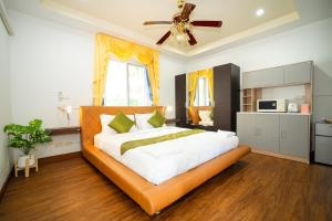 Postel nebo postele na pokoji v ubytování ฺBaan Waru seaview villa