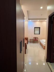 a hotel room with a bed and a bathroom at ĐÔNG THÀNH in Hòa Ðình