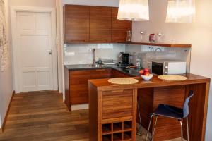 Kuchyňa alebo kuchynka v ubytovaní Apartamenty Straszewskiego