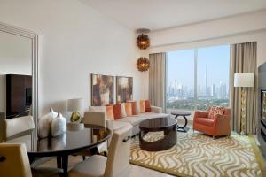 a living room with a couch and a table at Marriott Executive Apartments Dubai Al Jaddaf in Dubai