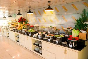 a buffet line with many plates of food at ELC Beach Hotel in Da Nang