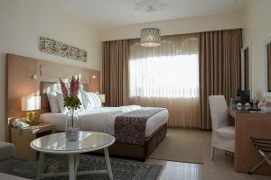 Posteľ alebo postele v izbe v ubytovaní Toledo Amman Hotel