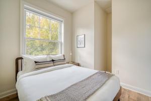 a bedroom with a large bed and a window at Dupont Circle 1br w wd nr metro station WDC-747 in Washington, D.C.