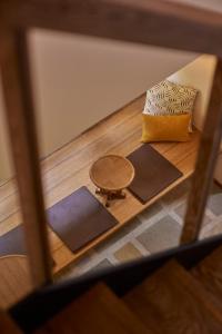 a view of a floor with mats and a table at tamao-たま靑- in Kyoto