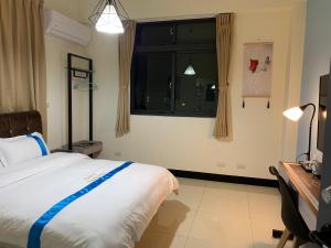 Letto o letti in una camera di 塔斯汀精品民宿