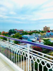 a balcony with a view of a city at Lavender Muine Hotel in Mui Ne