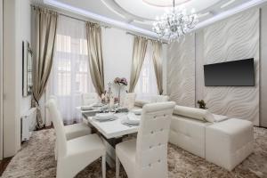 A television and/or entertainment centre at Opera Balkony Luxury Apartment with free parking