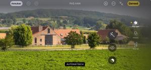 an image of a house in a field at B&B - Ter Douve in Dranouter
