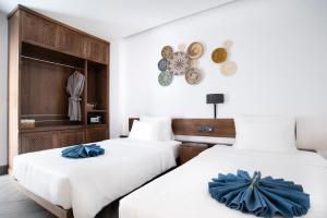 Postel nebo postele na pokoji v ubytování Velar Hotel Con Dao - Vung Tau