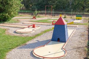 a playground with several skateboards in a park at Wellness Hotel Katalin in Gyenesdiás